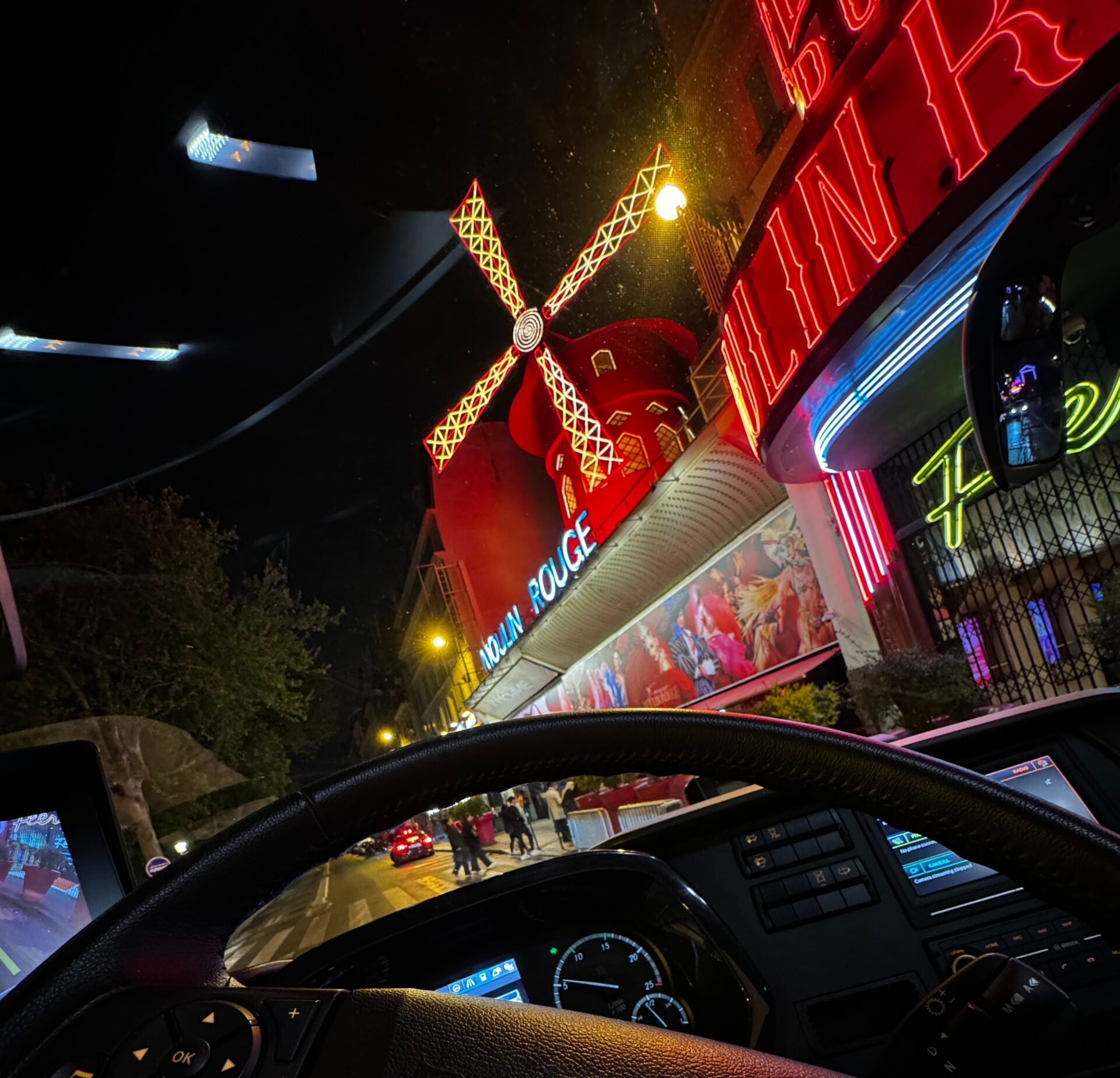 View from Inside coach with view of Moulin rouge by night